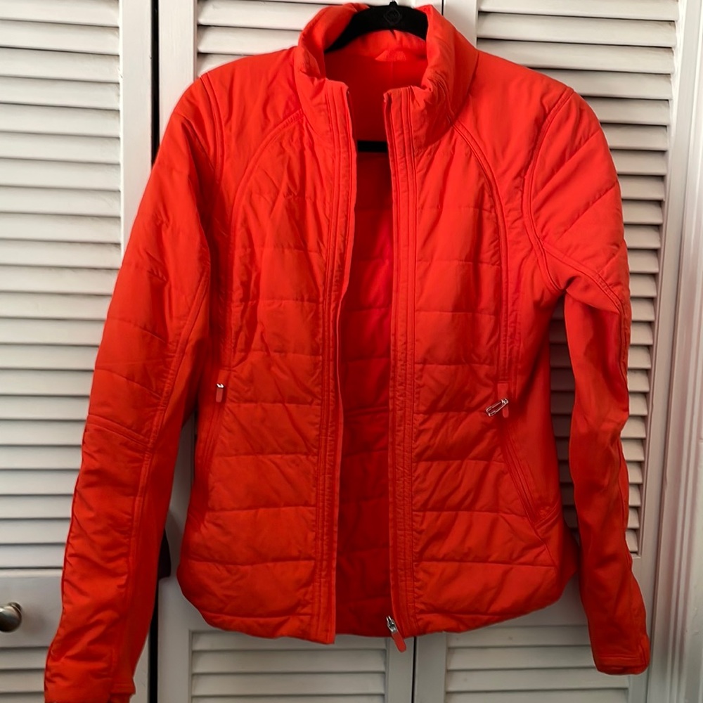 Lululemon orange/red jacket with zip in, removable hood.